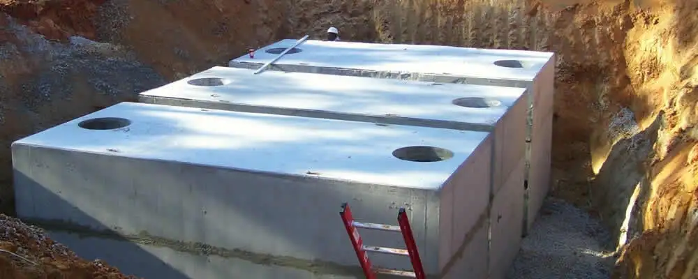 Septic tank installation site with a newly placed concrete tank in Memphis, TN